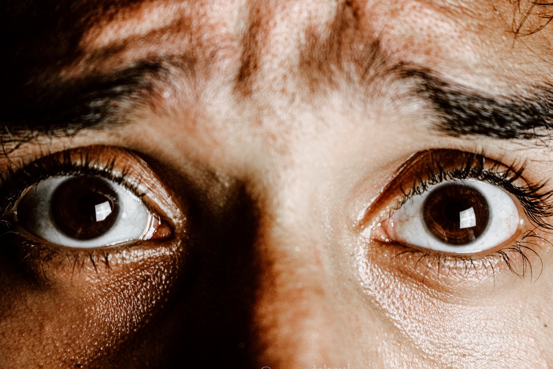 brown eyes of scared young person | Do You Have This Hole Phobia?