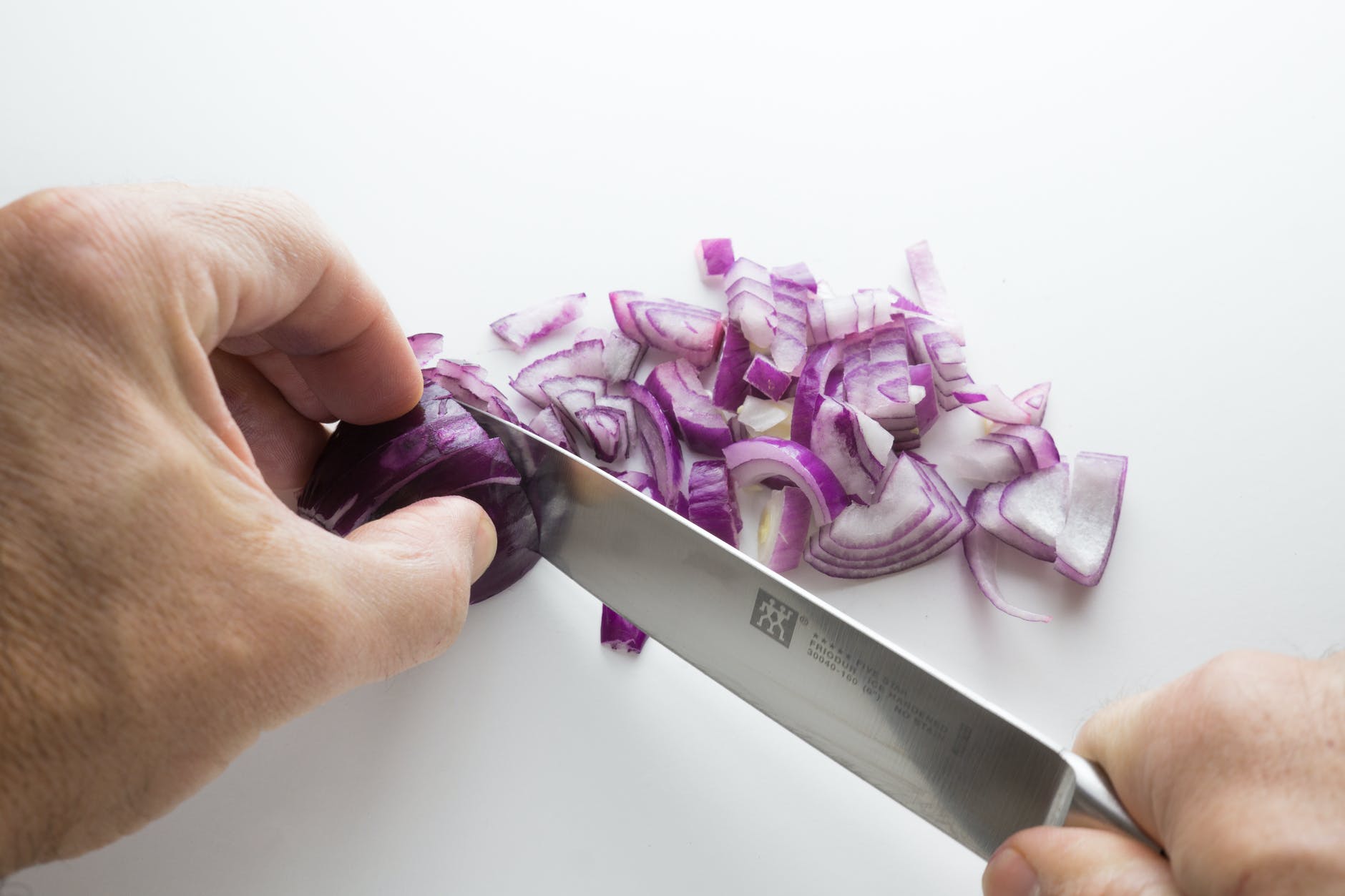 person s chopping onion