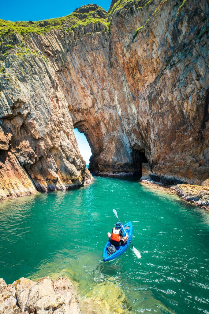 Kayaking along impressive sea caves. Photo credit Jessica.lkw